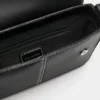 Borsa a tracolla con impunture Borsa a tracolla con impunture