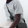Borsa a tracolla con impunture Borsa a tracolla con impunture