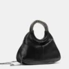 Borsa con manico metallico Borsa con manico metallico
