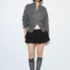 Cardigan con zip Cardigan con zip