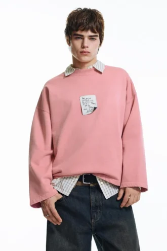 Felpa con etichetta rosa