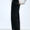 Jeans a gamba dritta con borchie