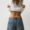 Jeans a gamba dritta e ampia con orli risvoltati