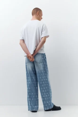 Jeans a gamba larga con stampa a stelle