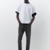 Jeans a zampa con effetto schizzi di vernice