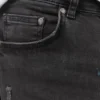 Jeans a zampa con effetto schizzi di vernice