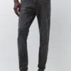 Jeans a zampa con effetto schizzi di vernice