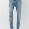 Jeans a zampa con effetto schizzi di vernice