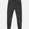 Jeans a zampa con effetto schizzi di vernice