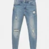 Jeans a zampa con effetto schizzi di vernice