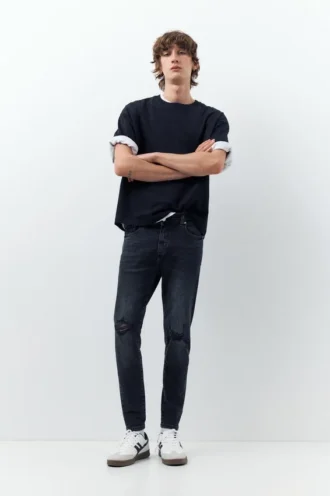 Jeans skinny strappati