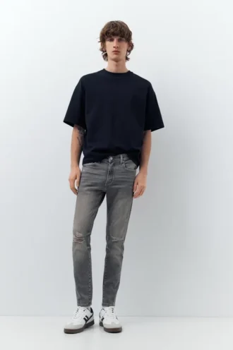 Jeans skinny strappati