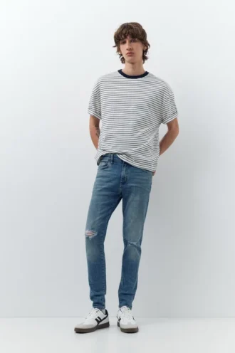 Jeans skinny strappati