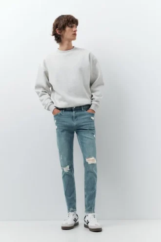 Jeans skinny strappati
