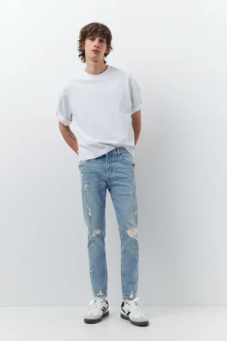 Jeans skinny strappati