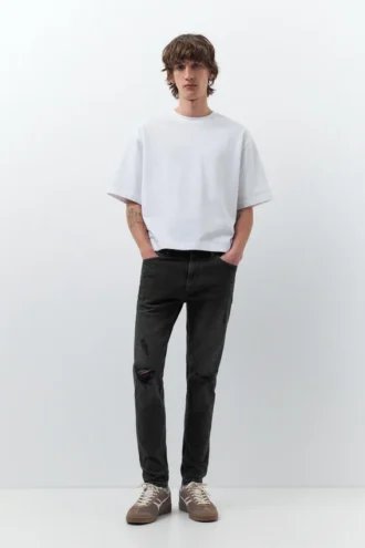 Jeans skinny strappati