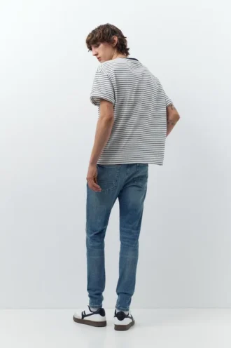 Jeans skinny strappati