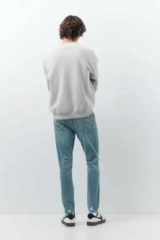 Jeans skinny strappati