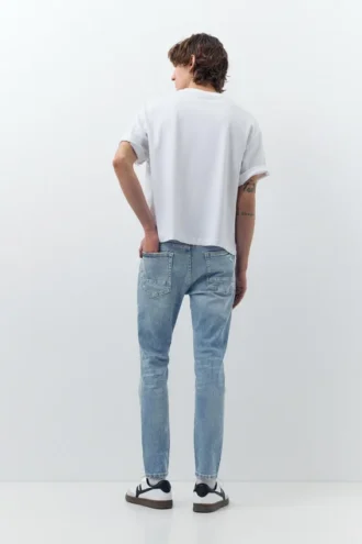 Jeans skinny strappati