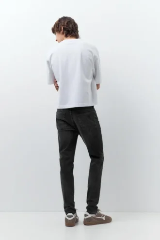 Jeans skinny strappati