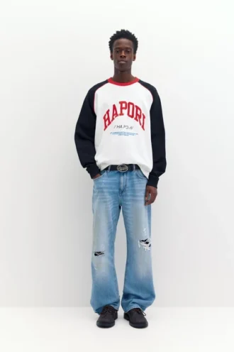 Jeans slim fit a zampa strappati