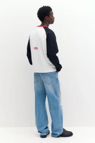 Jeans slim fit a zampa strappati