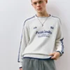 Maglione a righe con ricamo STWD