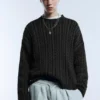 Maglione a trecce con lavaggio acid wash