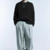 Maglione a trecce con lavaggio acid wash