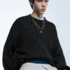 Maglione a trecce con lavaggio acid wash