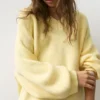 Maglione oversize con orlo asimmetrico Maglione oversize con orlo asimmetrico