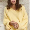 Maglione oversize con orlo asimmetrico Maglione oversize con orlo asimmetrico