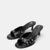 Mules con tacco e borchie Mules con tacco e borchie