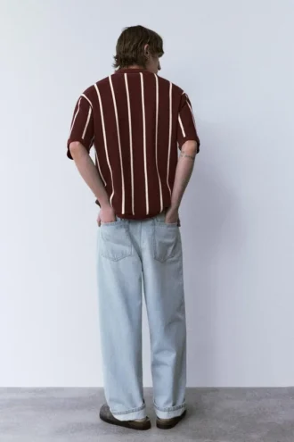 Polo in maglia a righe con cerniera