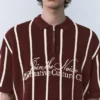Polo in maglia a righe con cerniera Polo in maglia a righe con cerniera