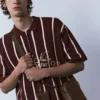 Polo in maglia a righe con cerniera Polo in maglia a righe con cerniera