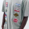 T-shirt a maniche corte con toppe T-shirt a maniche corte con toppe