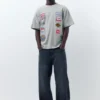 T-shirt a maniche corte con toppe T-shirt a maniche corte con toppe