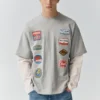 T-shirt a maniche doppie con toppe T-shirt a maniche doppie con toppe