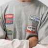T-shirt a maniche doppie con toppe T-shirt a maniche doppie con toppe