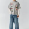 T-shirt a maniche doppie con toppe T-shirt a maniche doppie con toppe