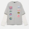 T-shirt a maniche doppie con toppe T-shirt a maniche doppie con toppe