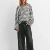 T-shirt a righe con scritta T-shirt a righe con scritta