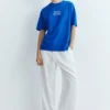 T-shirt blu con grafica e slogan T-shirt blu con grafica e slogan