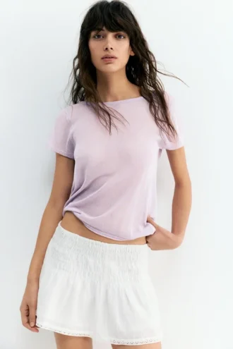 Top in maglia a maniche corte con schiena scoperta